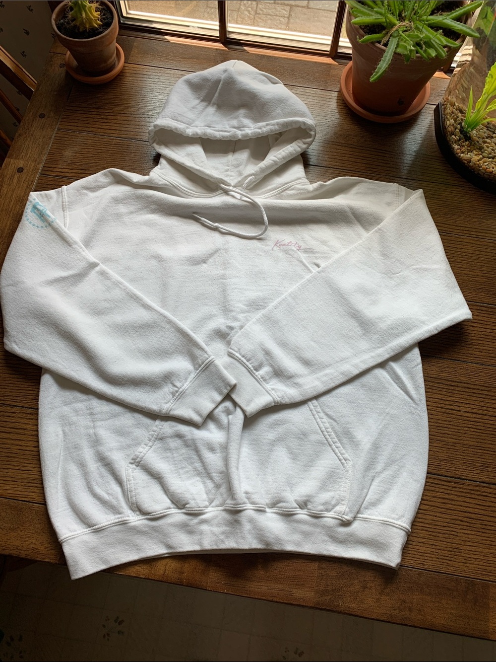 Koatity white hoodie with Barstool logo on left arm.